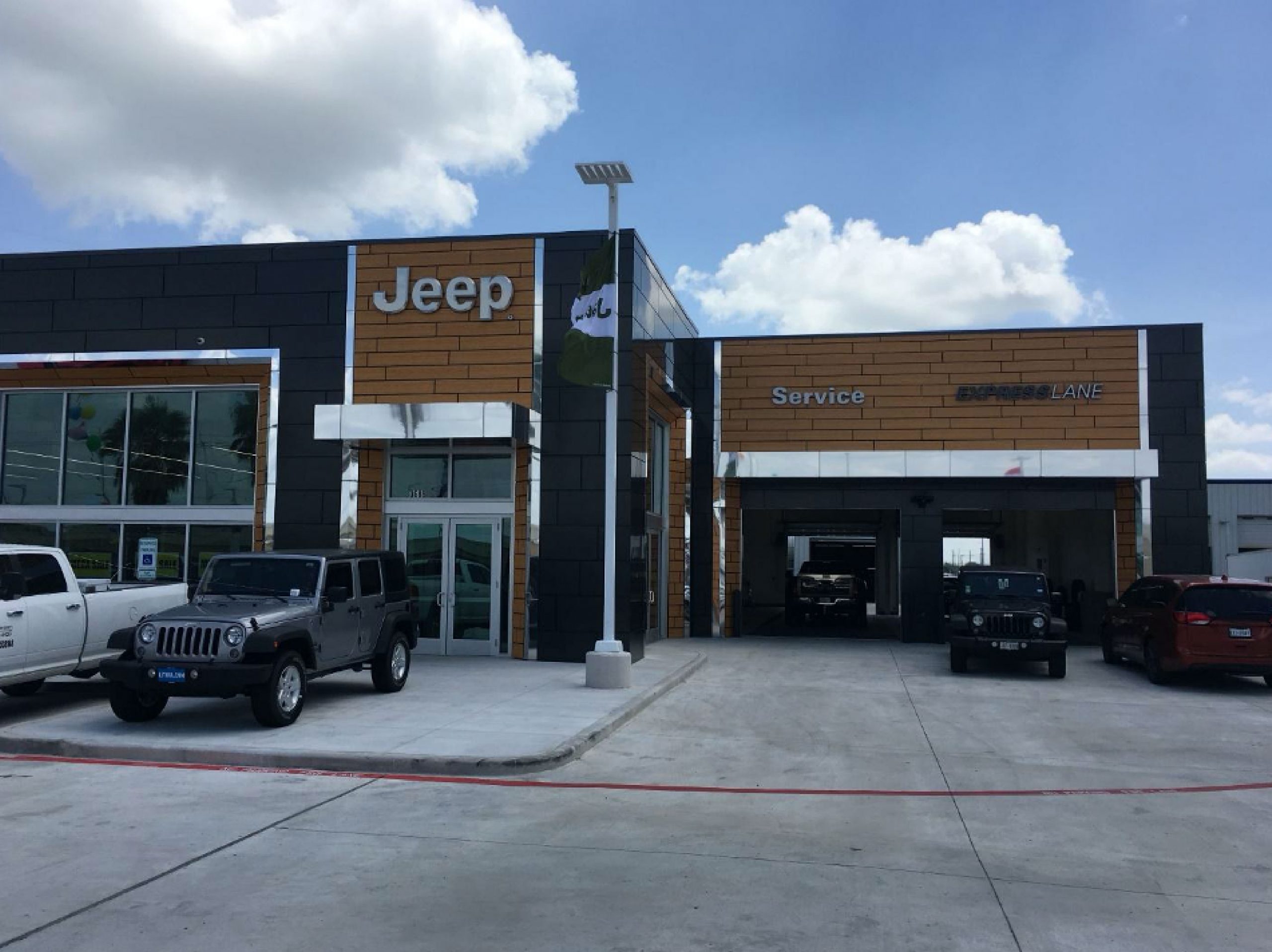 parked jeeps in front of jeep service shop